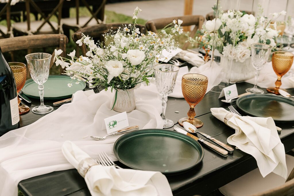 tablescape featuring silverware, florals and glassware at a snake river ranch wedding.