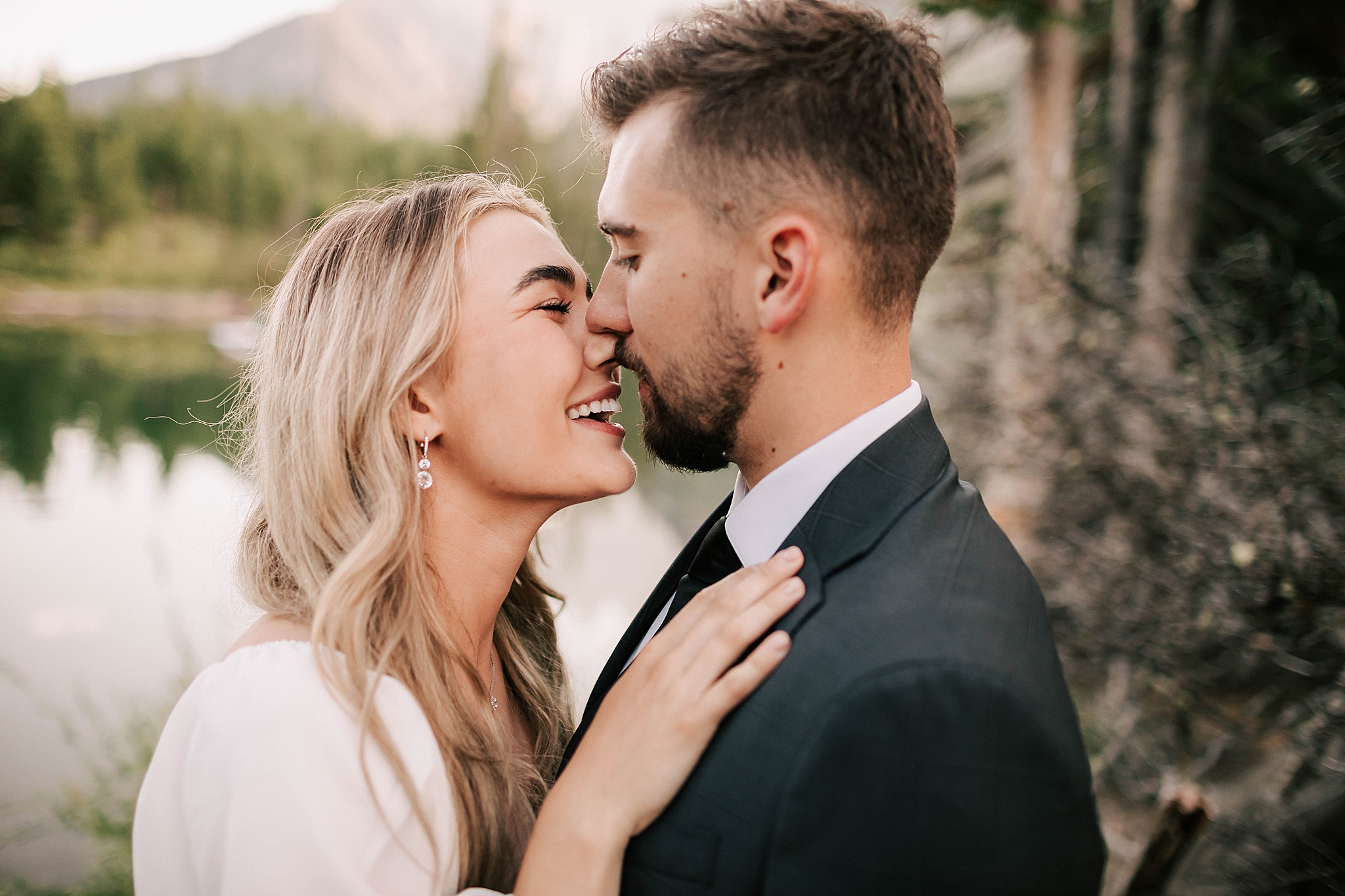 bride and groom kissing at their diaond cross ranch wedding taken by jackson hole wedding photographer adrian wayment photo
