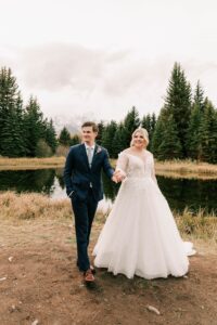bride and groom walking together after their schwabacher landing wedding. photo taken by local jackson wedding photographer adrian wayment.
