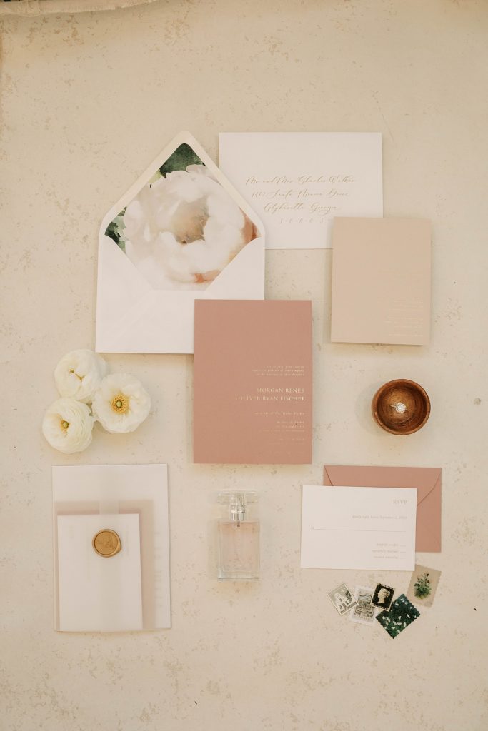 wedding day details including stationary, rings and perfume at split creek ranch taken by photographer adrian wayment.