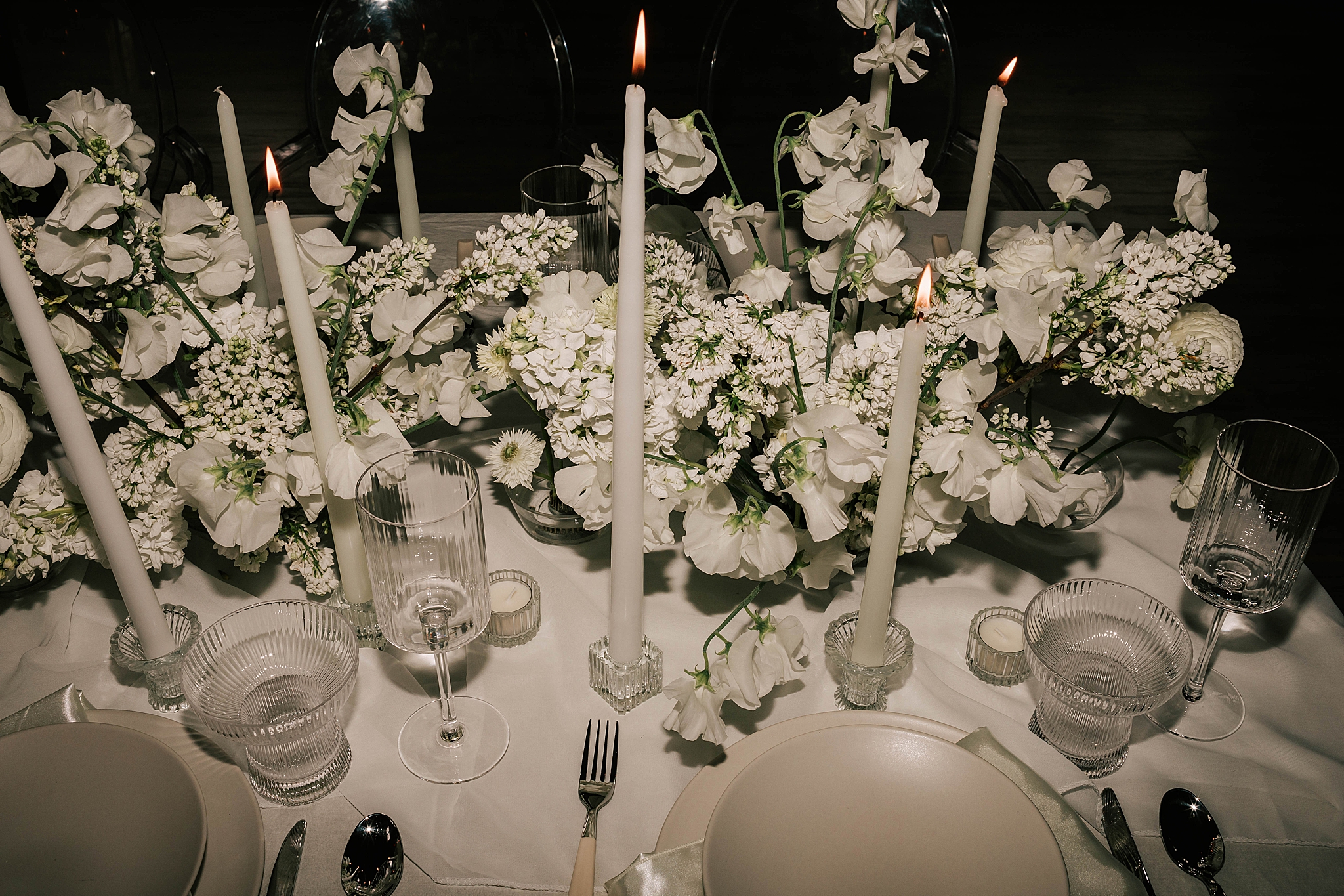 wedding tablescape at a luxury caldera house wedding taken by adrian wayment photo.
